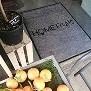 Customized entrance mat with retailer logo
